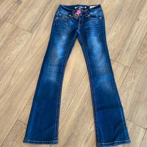 Bootleg dark wash, brand new CP jeans with Crystal embellished grommets/buttons